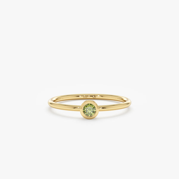 yellow gold peridot bezel ring