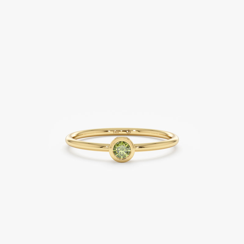 yellow gold peridot bezel ring