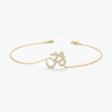 Gold OM bracelet with diamonds
