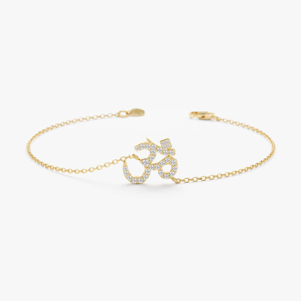 Gold OM bracelet with diamonds