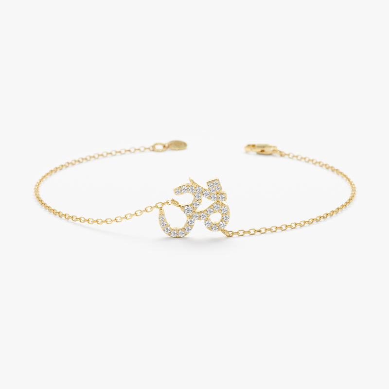 Gold OM bracelet with diamonds