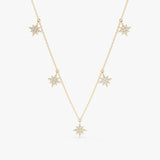 handmade solid gold dainty necklace with multiple starburst hanging charms with paved diamonds