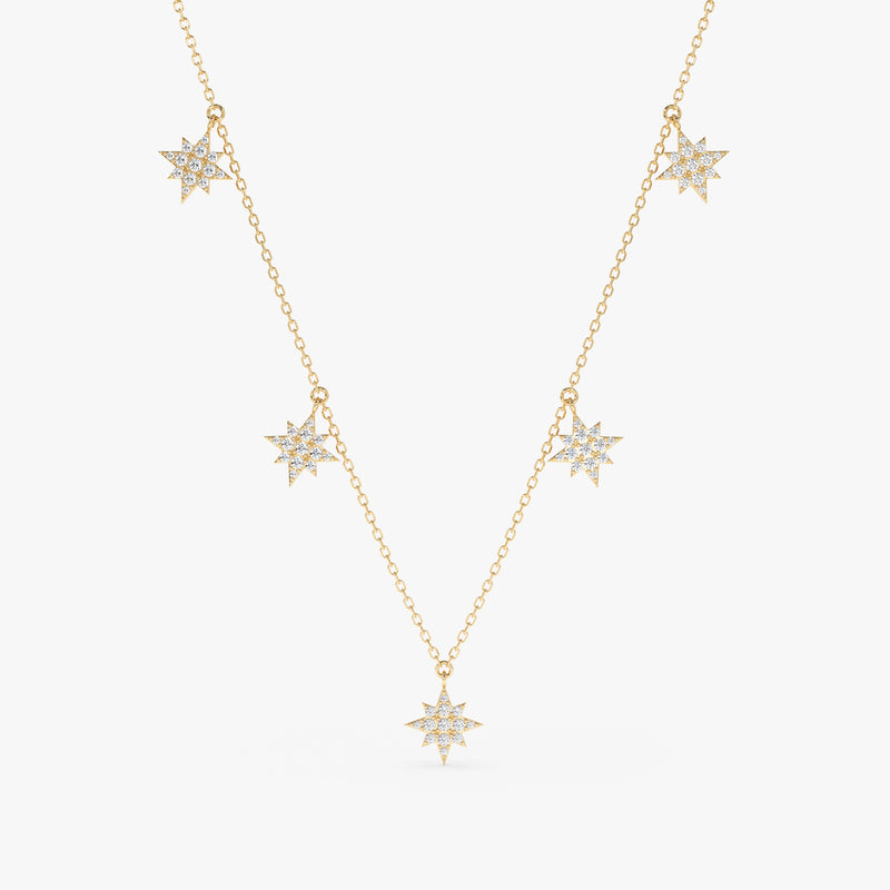 handmade solid gold dainty necklace with multiple starburst hanging charms with paved diamonds