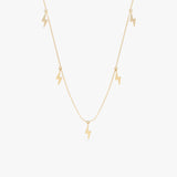 Lightning bolt drop necklace in gold with five polished lightning bolt charms.