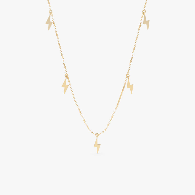 Lightning bolt drop necklace in gold with five polished lightning bolt charms.