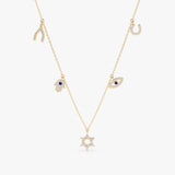 solid gold necklace with horseshoe charm, wishbone, hamsa hand, eye and star of david protective charms in lined diamonds with blue sapphire