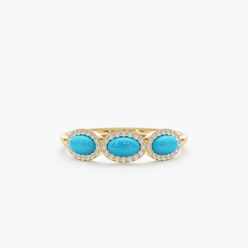 three turquoise gemstones with diamond halo in yellow gold
