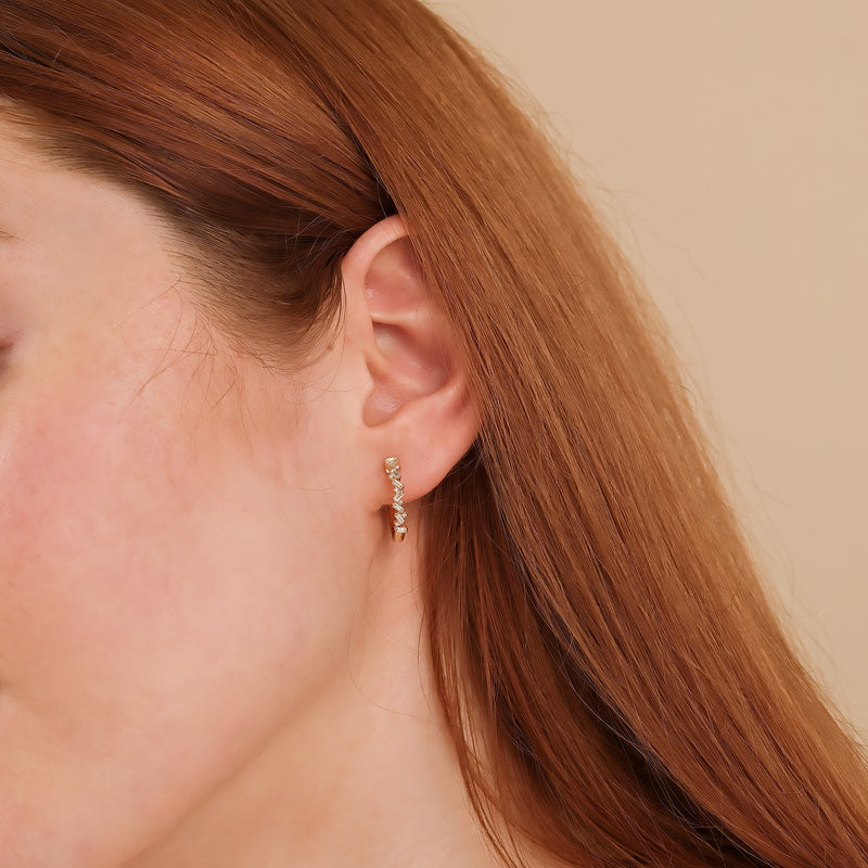 Model wears april birthstone stacked baguette natural diamonds earring hoop