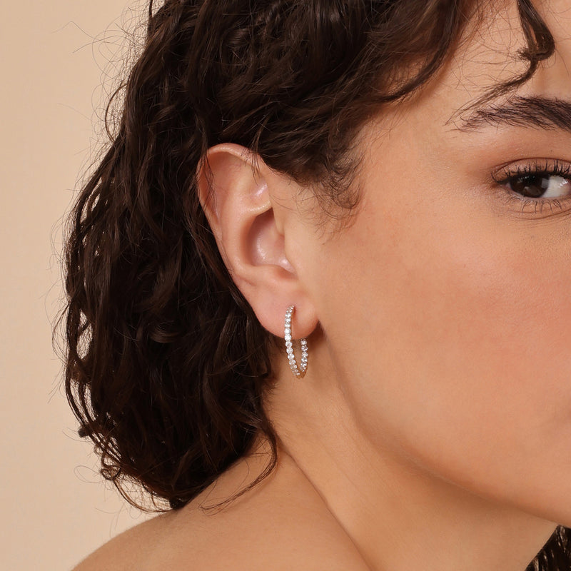 ethically sourced solid gold white diamond huggies