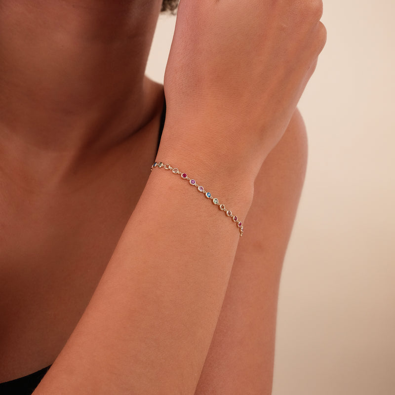 bezel set sapphires, gold bangle