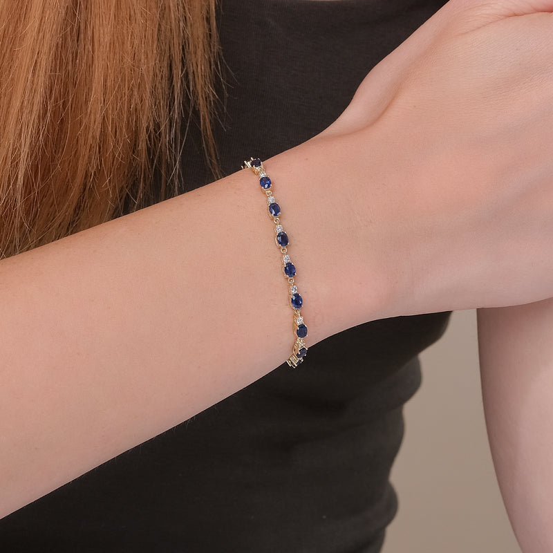 Exquisite garland bracelet featuring vibrant blue sapphires and sparkling diamonds.