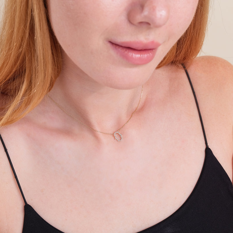 minimalist diamond hamsa hand pendant necklace in solid gold 