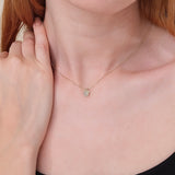 dainty diamond paw pendant necklace in solid gold