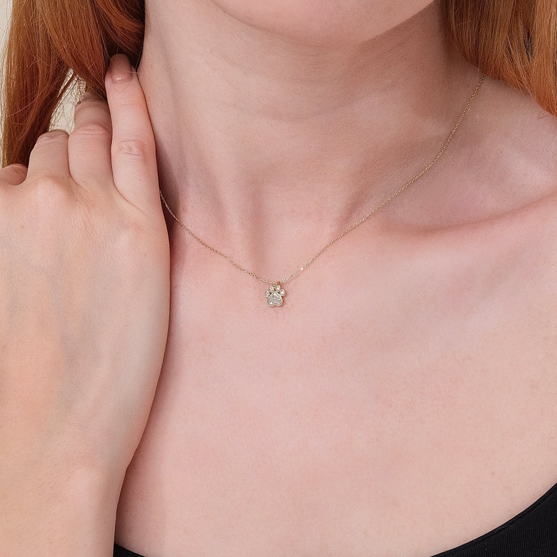 dainty diamond paw pendant necklace in solid gold