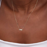 minimalistic love word pendant necklace with diamonds