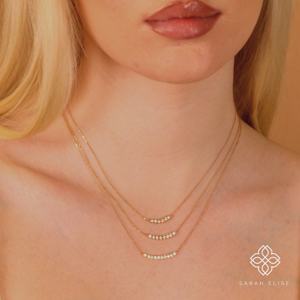 minimalist solid gold multiple diamond bezel curved bar necklace for her