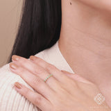 dainty emerald and diamond half eternity band