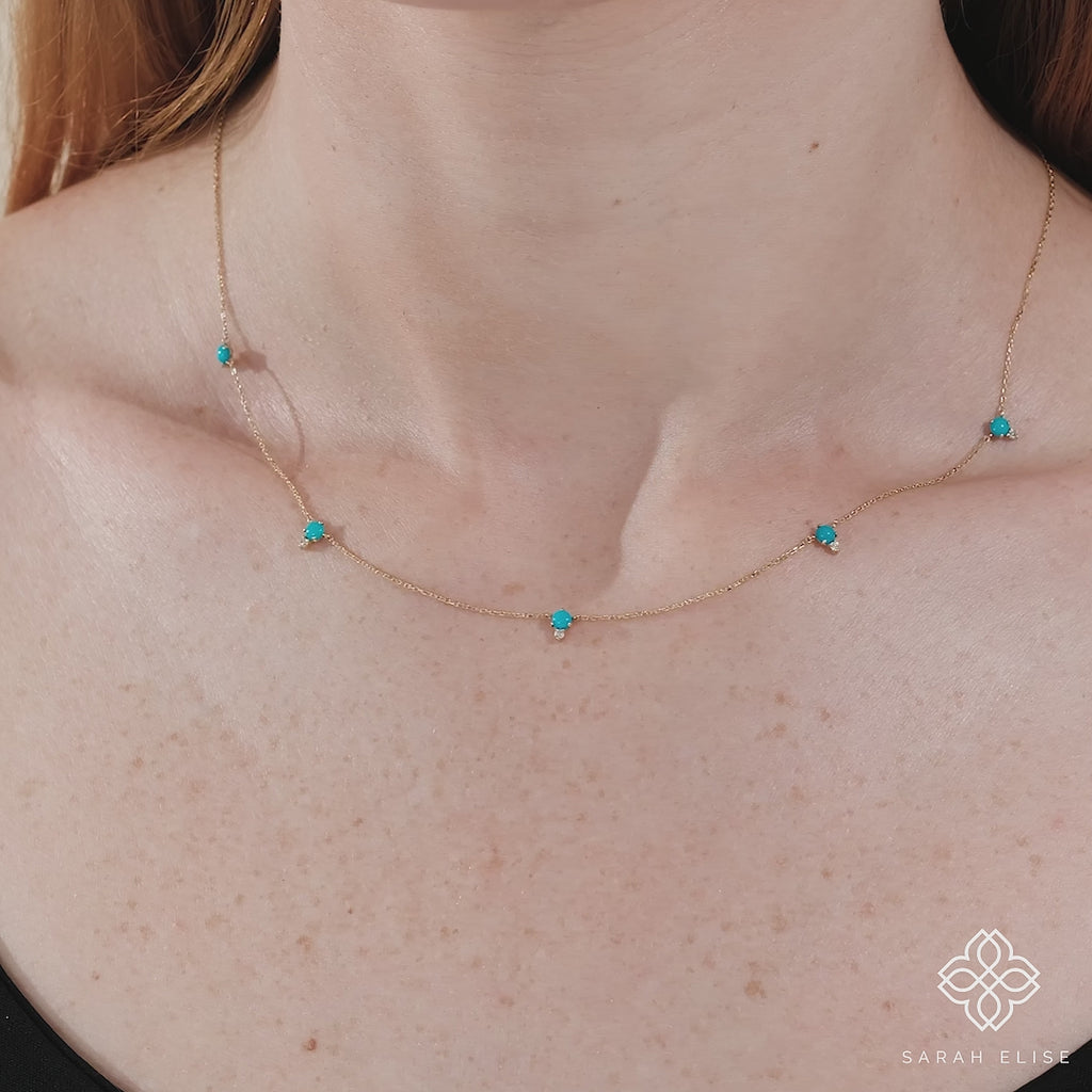 handcrafted solid gold necklace with dainty turquoise stones and diamonds