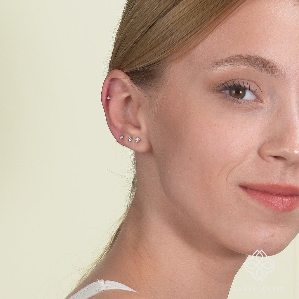 Video close up of multiple sizes of a classic 4 prong natural diamond set in 14k solid gold. 