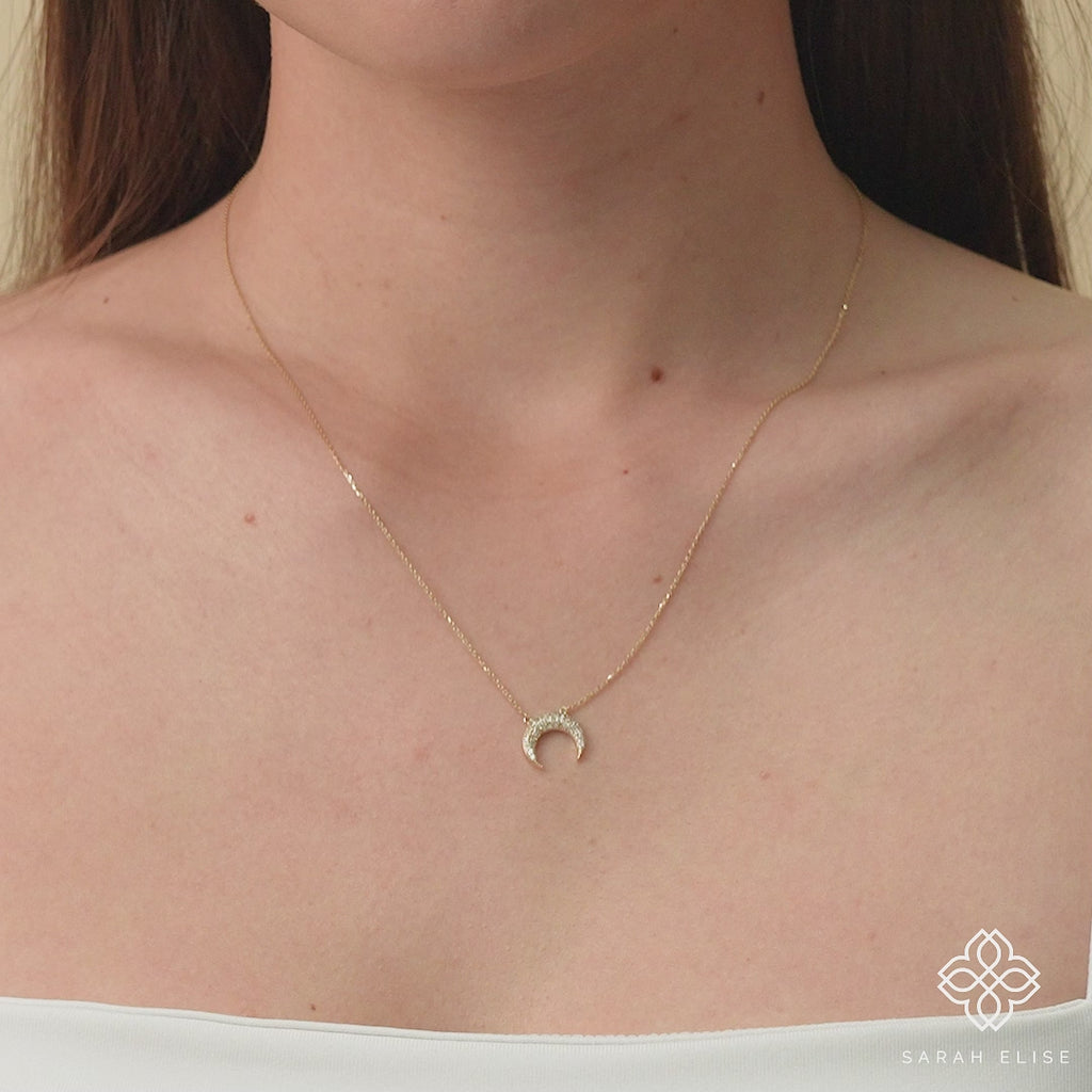 Celestial diamond crescent moon pendant on a 14k gold chain