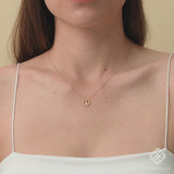solid gold heart outline with single diamond bezel necklace
