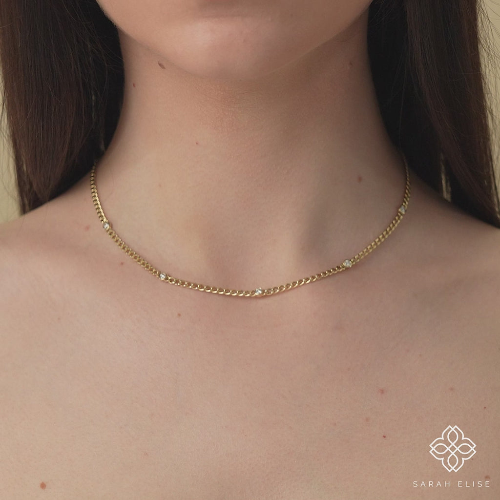 solid gold cuban chain necklace with five diamond bezels in solid gold