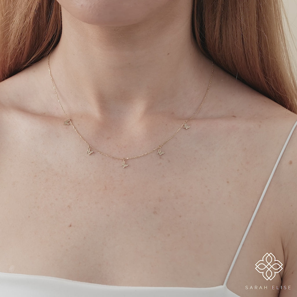 solid gold handmade necklace with multiple diamond butterfly charms for her