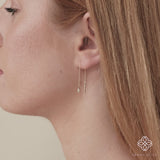 Video close up of ethically sourced handmade April birthstone diamond disc threader earring in solid 14k gold