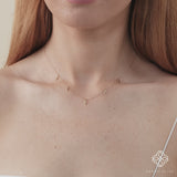 dainty chain necklace with five lightning bolt charms in gold.