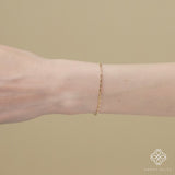 Geometric weave bracelet in 14k gold with a rectangular box chain