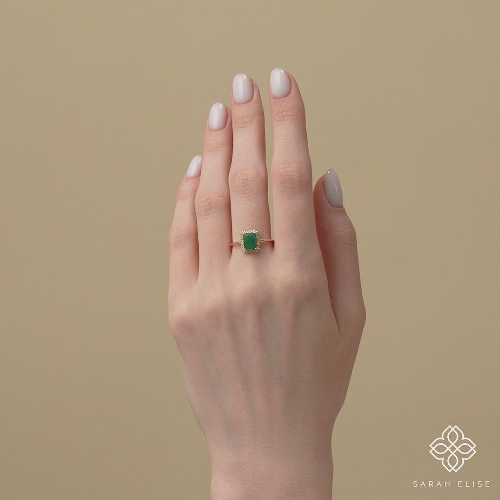 ethically sourced emerald diamond engagement ring