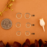 Solid 14k gold natural gemstone lined huggies in three sizes