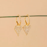 pair of solid 14k yellow gold heart diamond earrings