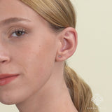 model wears Dainty Diamond and Gold spike stud Earrings