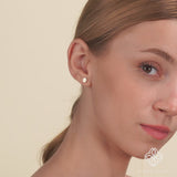 Video close up of 14k solid gold flat circle stud earring with lined diamonds gift for her