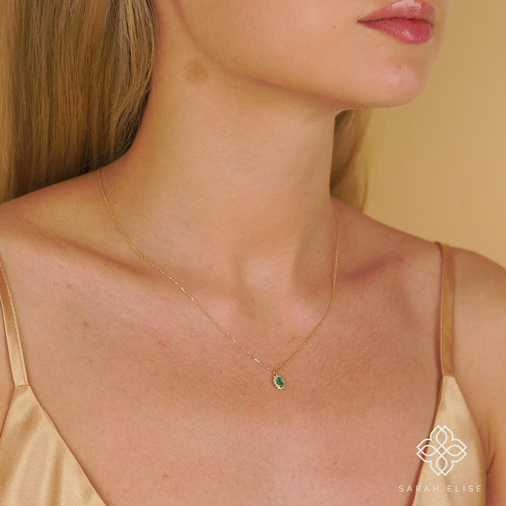 Cute emerald and diamond halo necklace