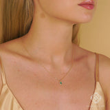 Cute emerald and diamond halo necklace