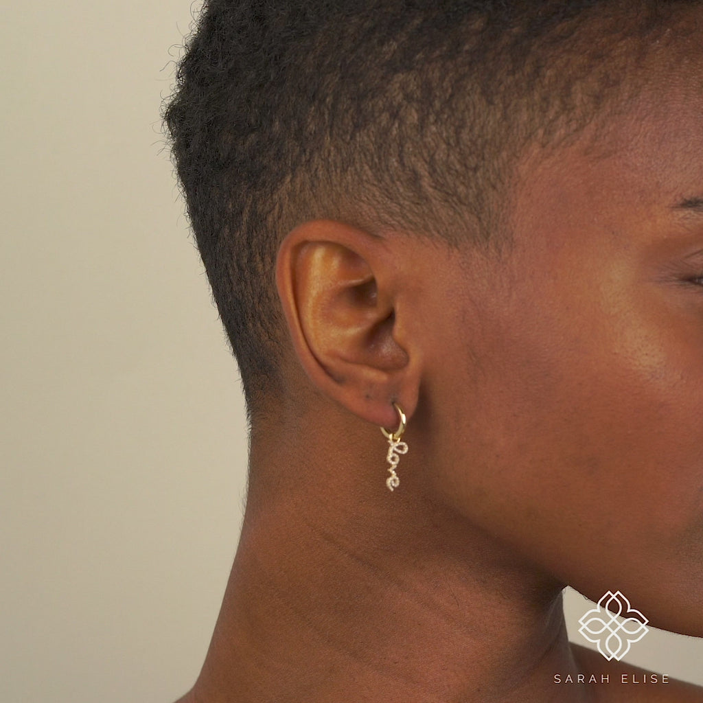 Video close up of Dangling Love diamond encrusted  Hoop huggies for her