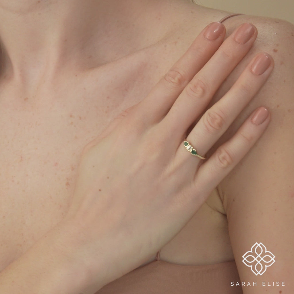 drop shape emeralds with diamond ring