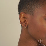 Video close up of dainty Handmade Natural Diamond Huggies in solid gold