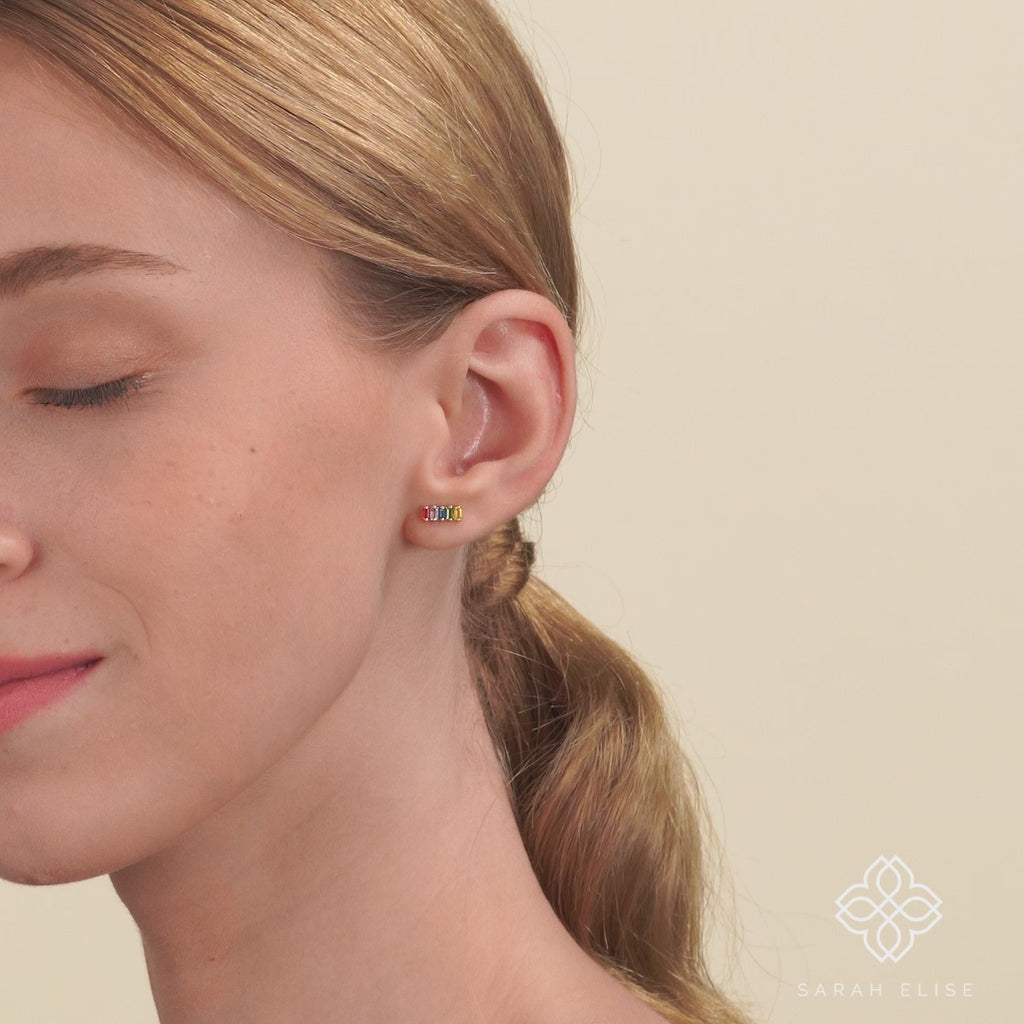 Video close up of model wearing Natural Rainbow Sapphire bar Stud gift for her