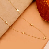 Gold necklace with multiple star charms