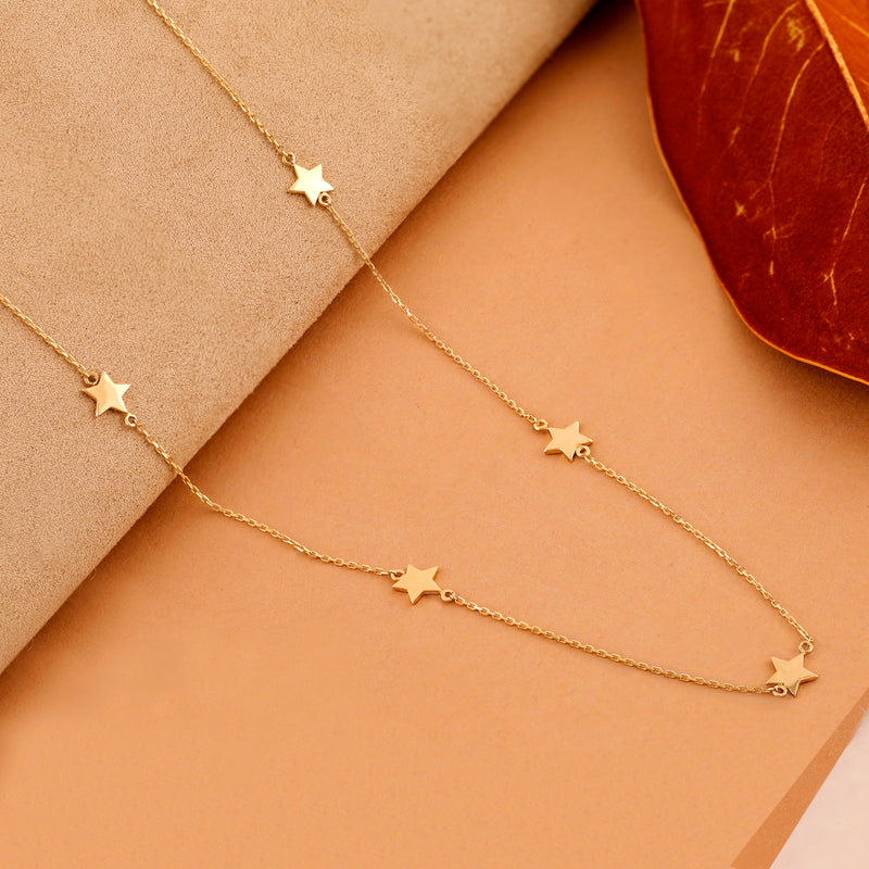Gold necklace with multiple star charms
