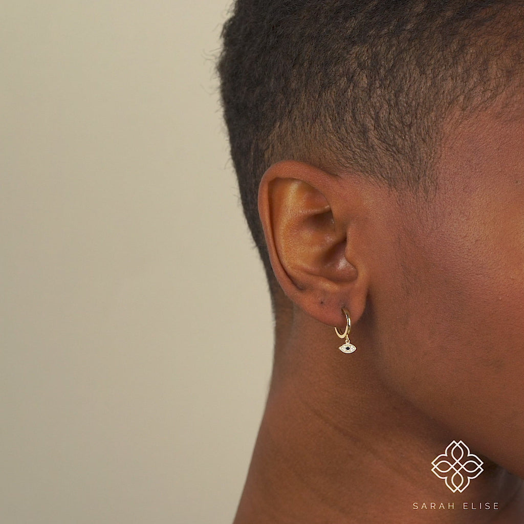 Diamond paved evil eye design with blue Sapphire Hoop huggie