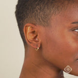 Video close up of Handmade single Natural Aquamarine Huggies in solid 14k gold for her