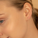 Model wears Bezel Setting Tourmaline October Huggies