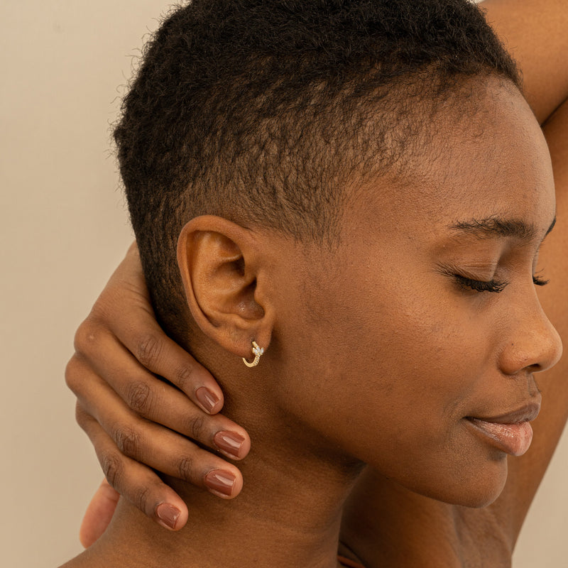 Model wears 14k Solid Gold Natural Diamond Hoop huggies for her