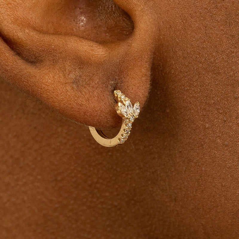 Model wears solid 14k gold triple marquise Diamond Gold Hoop huggie
