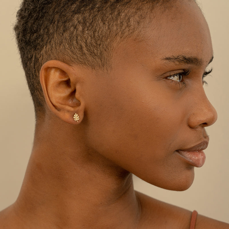 Model wears Dainty Diamond Palm Leaf Stud earring gift for her