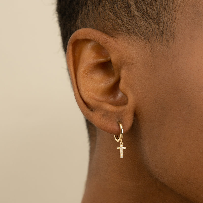 Model wears Gold Cross Earrings with Diamonds in solid gold